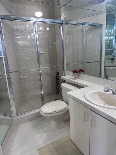 1000 West Island Boulevard, Unit 1511 Aventura, FL 33160 - Photo 20 of 41 a bathroom with a sink toilet and shower