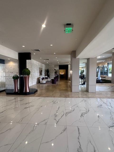 1000 West Island Boulevard, Unit 1511 Aventura, FL 33160 - Photo 26 of 41 a living room with furniture and a table