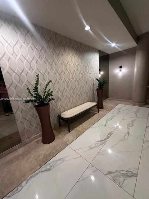 1000 West Island Boulevard, Unit 1511 Aventura, FL 33160 - Photo 29 of 41 a lobby with furniture and flowers