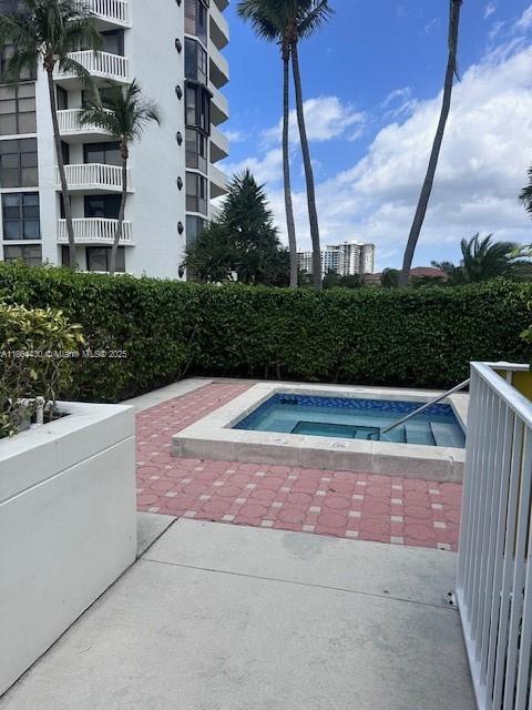 1000 West Island Boulevard, Unit 1511 Aventura, FL 33160 - Photo 33 of 41 a view of backyard with a swimming pool