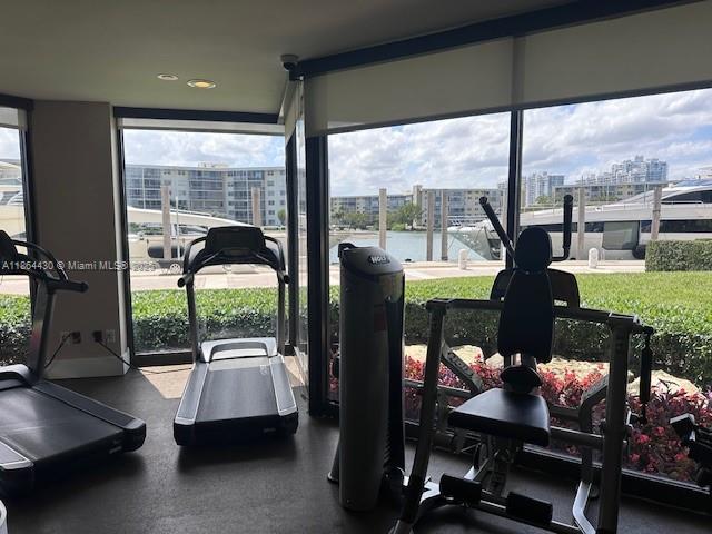 1000 West Island Boulevard, Unit 1511 Aventura, FL 33160 - Photo 37 of 41 a room with furniture and a large window