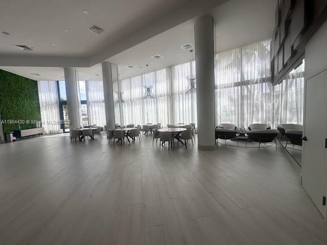 1000 West Island Boulevard, Unit 1511 Aventura, FL 33160 - Photo 39 of 41 a view of a room with gym equipment and floor to ceiling window