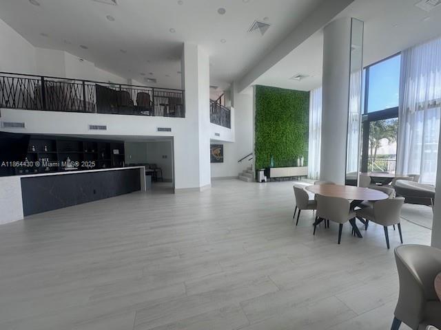 1000 West Island Boulevard, Unit 1511 Aventura, FL 33160 - Photo 40 of 41 a living room with furniture a window and kitchen view