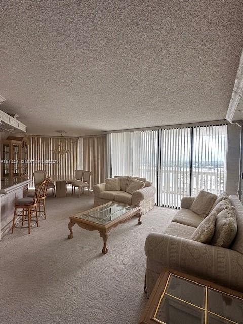 1000 West Island Boulevard, Unit 1511 Aventura, FL 33160 - Photo 5 of 41 a living room with furniture and a large window