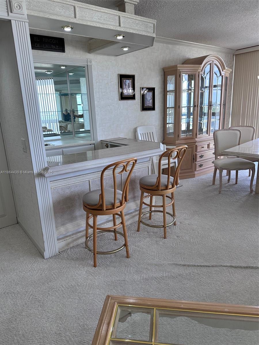 1000 West Island Boulevard, Unit 1511 Aventura, FL 33160 - Photo 9 of 41 a dining room with furniture and window