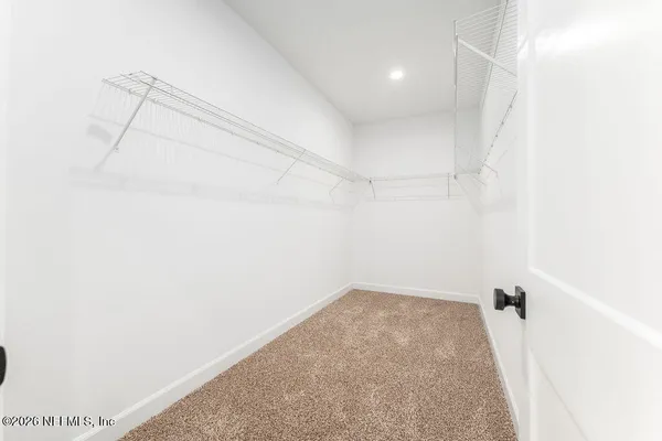 a view of a room with racks on the wall