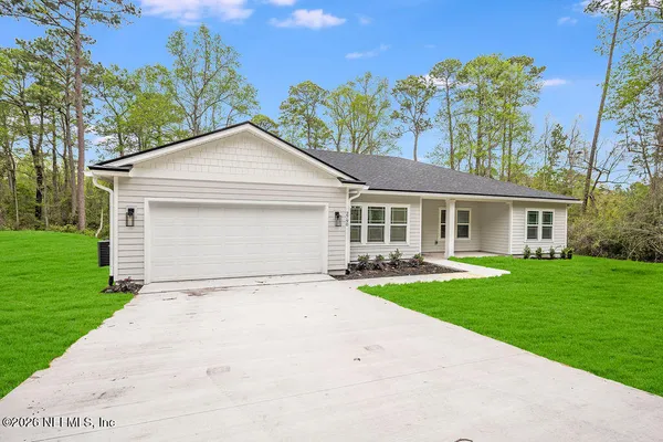 front view of a house with a yard