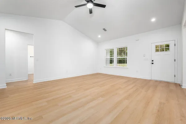 a view of an empty room with a window