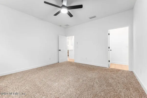 an empty room with fan