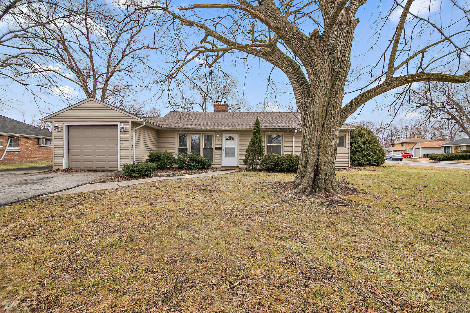 310 Nassau Street Park Forest, IL 60466 - Photo 1 of 19 a front view of a house with a yard