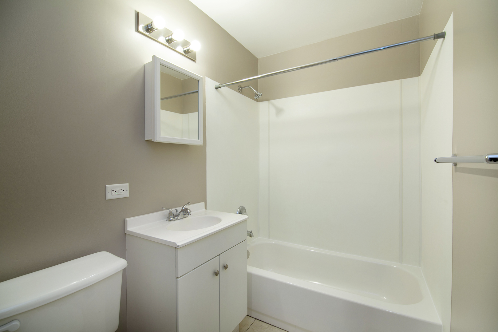 310 Nassau Street Park Forest, IL 60466 - Photo 18 of 19 a bathroom with a sink a mirror and a toilet