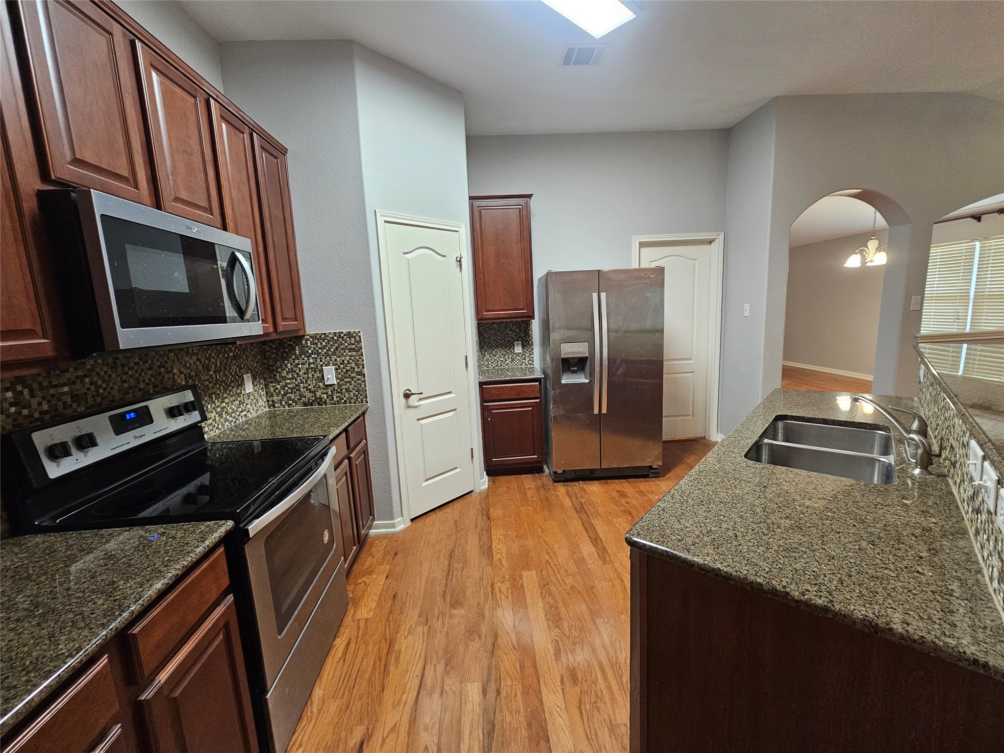 2035 Intrepid Drive Buda, TX 78610 - Photo 7 of 26 Culinary delights await in this kitchen featuring abundant cabinetry and sleek stainless appliances.
