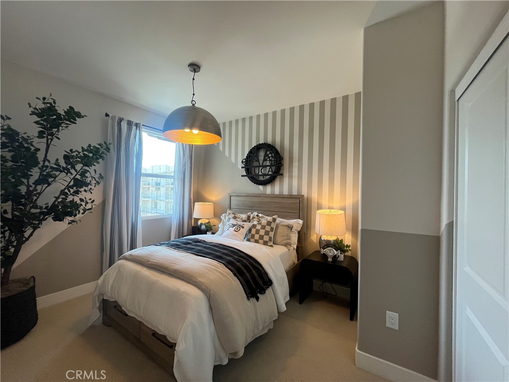 1872 Union, Unit 25 Anaheim, CA 92805 - Photo 23 of 41 a bedroom with a bed and a window