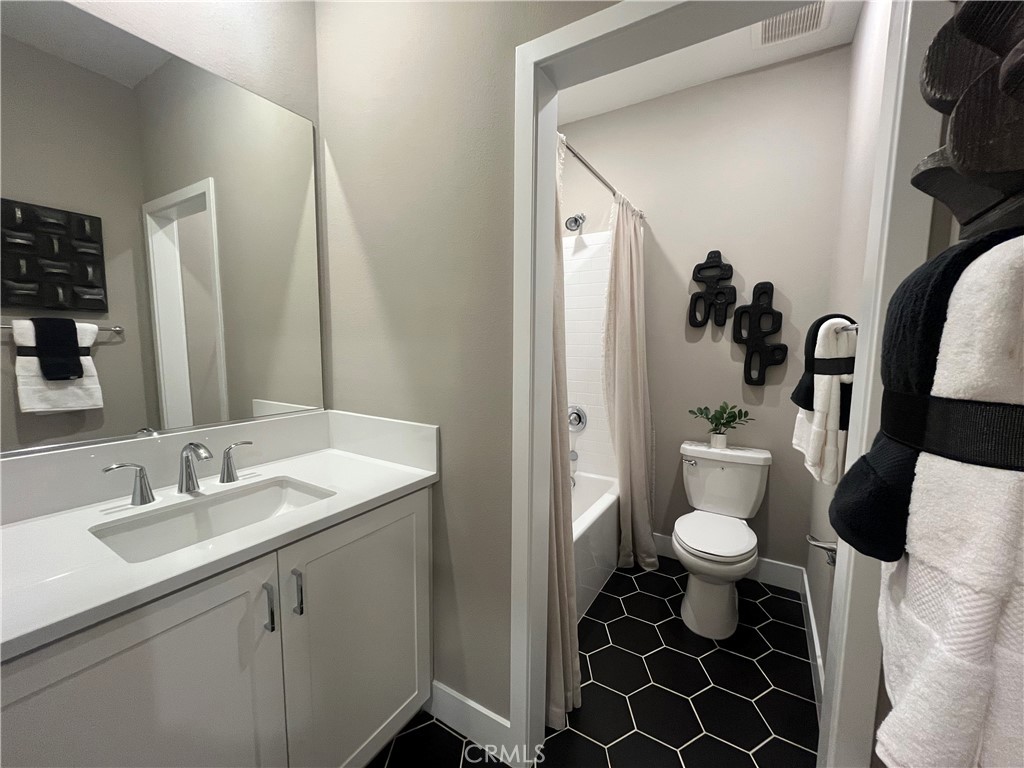 1872 Union, Unit 25 Anaheim, CA 92805 - Photo 25 of 41 a bathroom with a sink toilet and shower