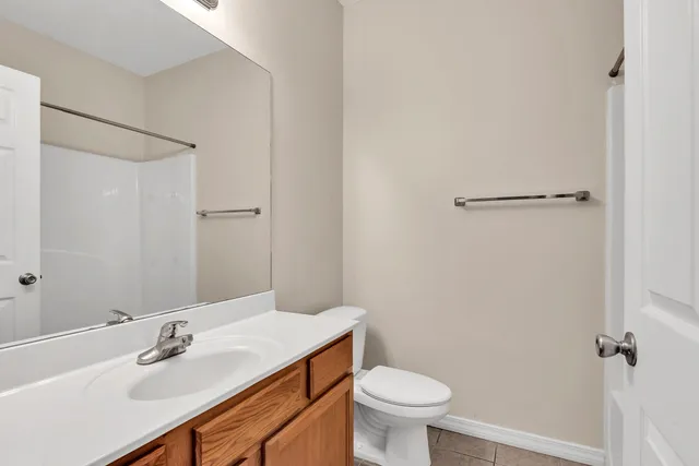 a bathroom with a sink toilet and vanity