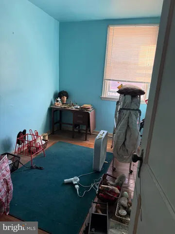 a room with furniture toys and a window