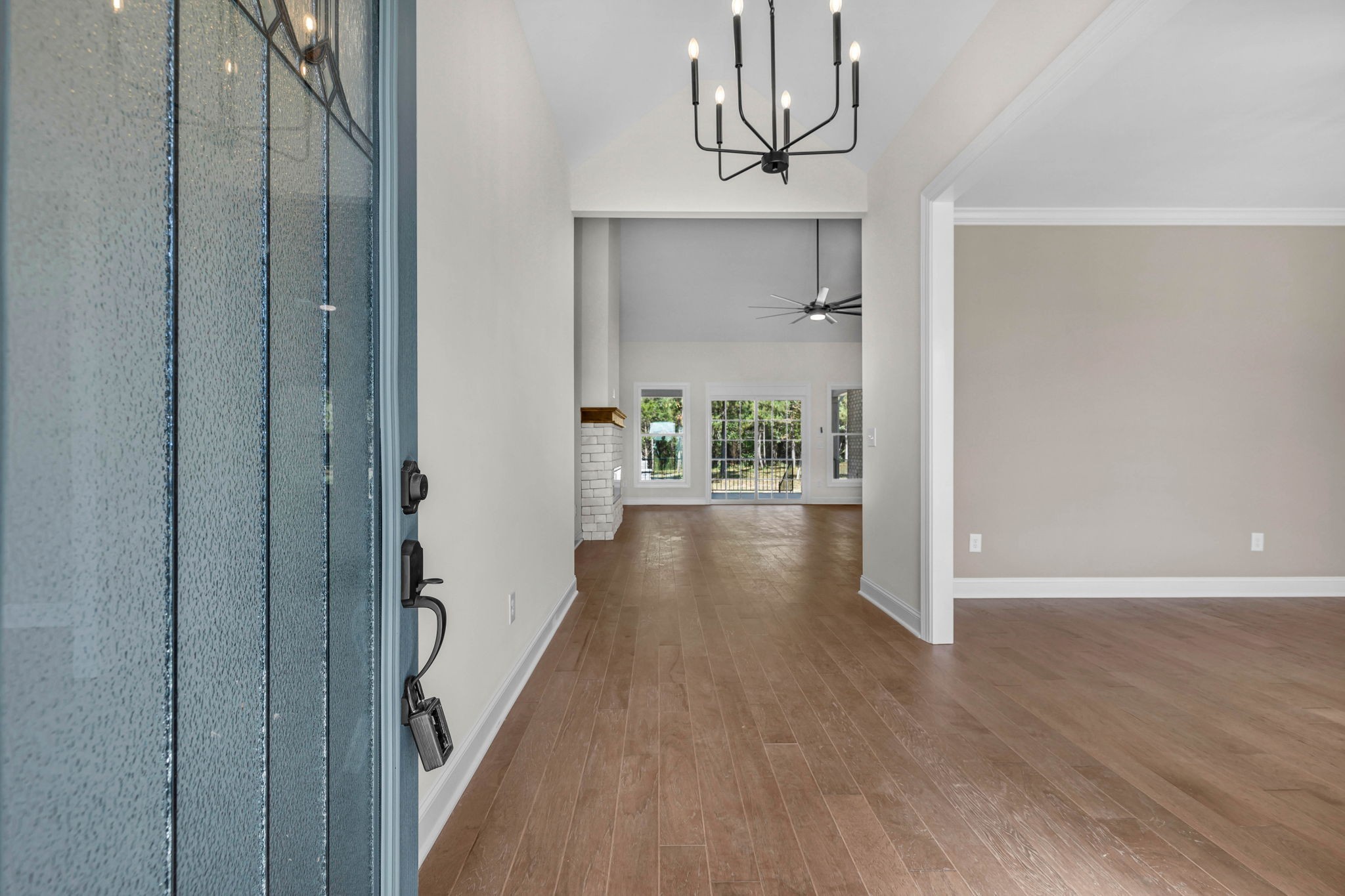 8708 Newtown Road Rockvale, TN 37153 - Photo 5 of 50 a view of a hallway with wooden floor and chandelier