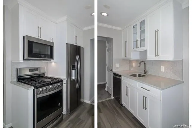 a kitchen with stainless steel appliances a stove a sink and a refrigerator