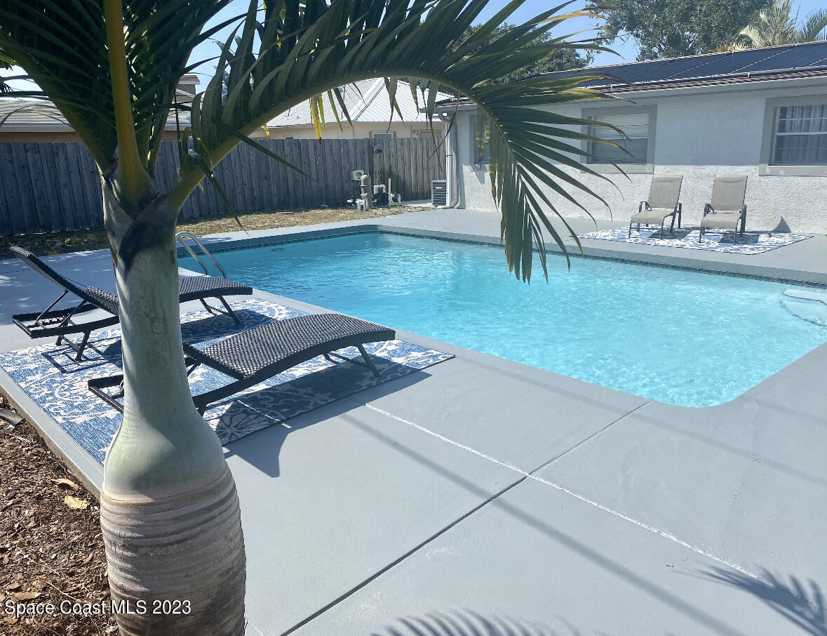 2785 Locksley Road Melbourne, FL 32935 - Photo 2 of 34 a backyard of a house with seating space