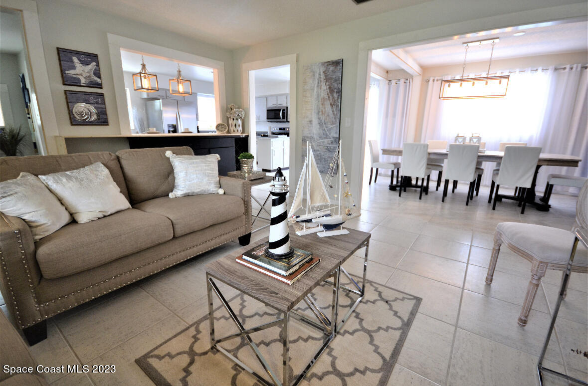 2785 Locksley Road Melbourne, FL 32935 - Photo 3 of 34 a living room with furniture and a large window