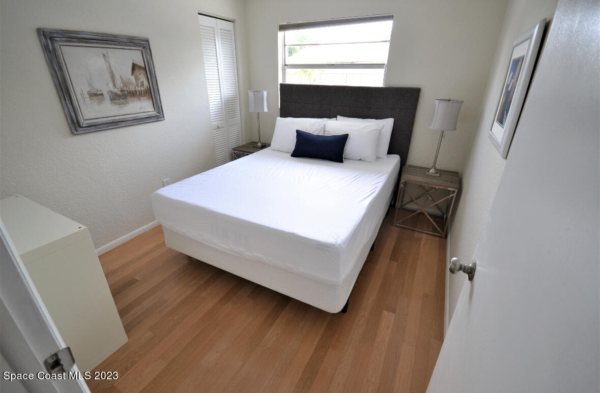 2785 Locksley Road Melbourne, FL 32935 - Photo 31 of 34 a bedroom with a bed and a window