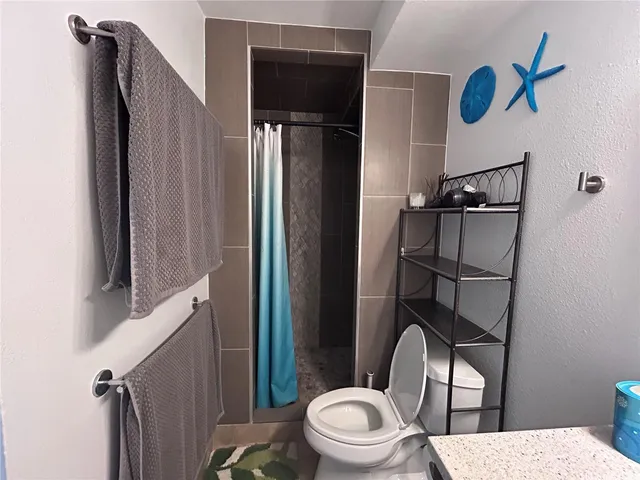 a bedroom with double bed and a large mirror