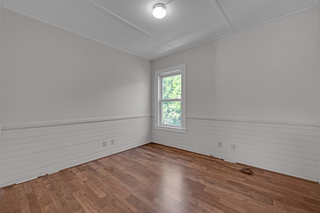 47 Morris Street Southbridge, MA 01550 - Photo 12 of 40 wooden floor in an empty room with a window