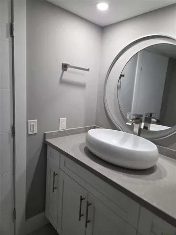 a bathroom with a shower a toilet and a sink