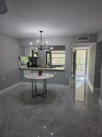 a kitchen with stainless steel appliances granite countertop a stove and a microwave