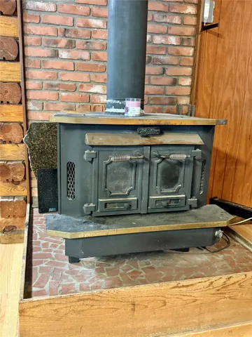 a bed room with furniture and a flat screen tv