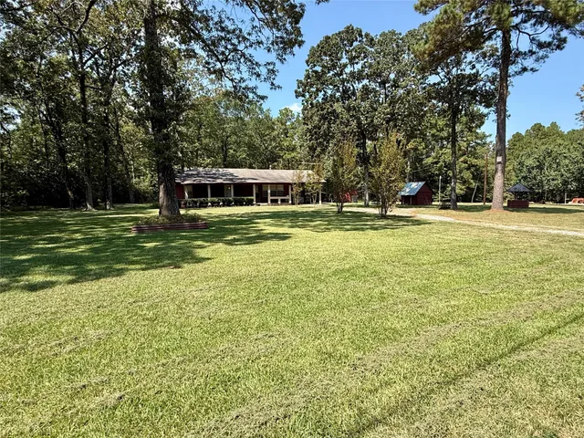 a view of a house with a big yard