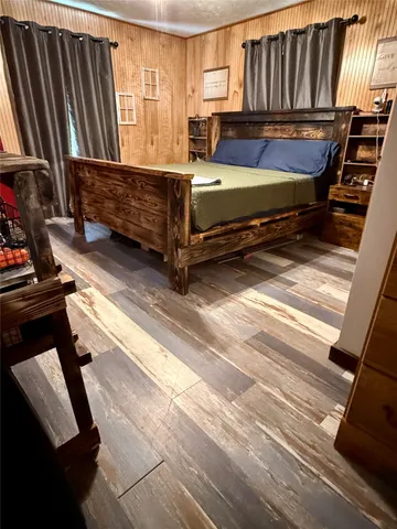 a view of kitchen with furniture and wooden floor