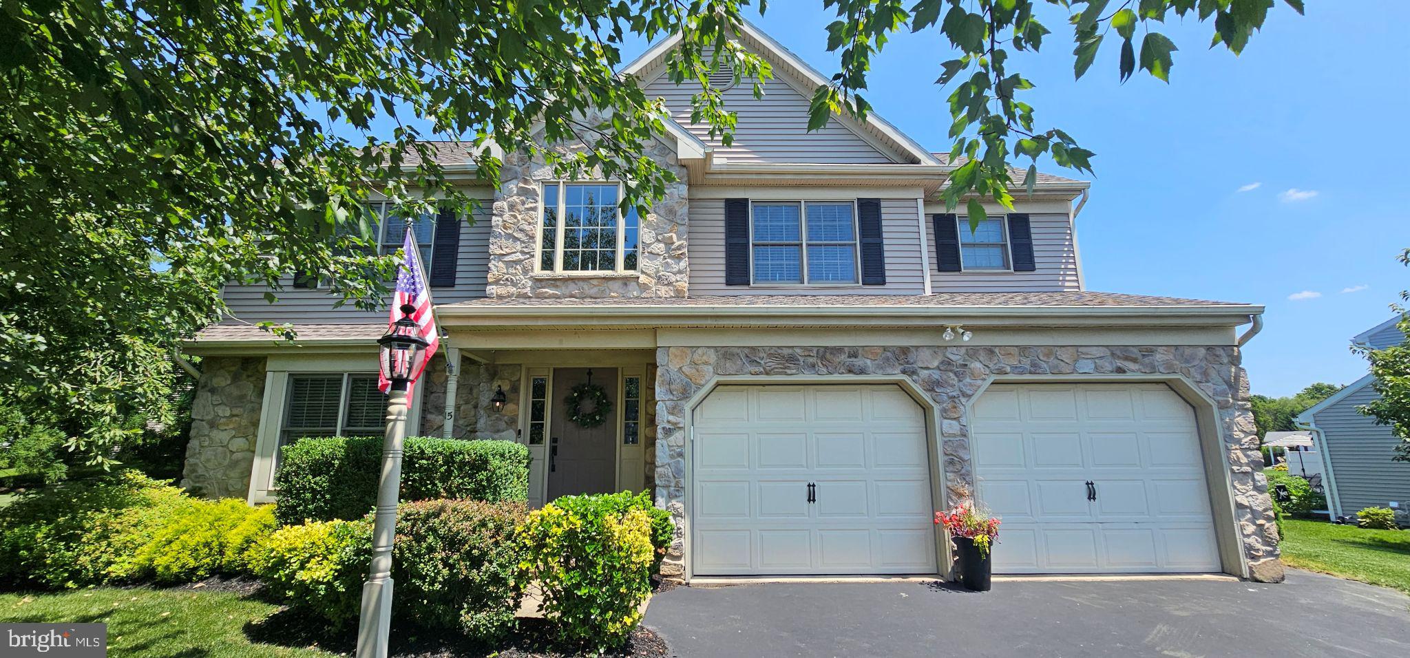 15 Limestone Court Lititz, PA 17543 - Photo 1 of 59 a view of a house with large windows and a small yard