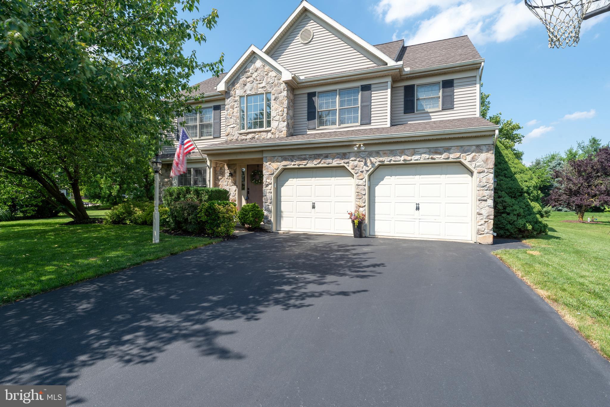 15 Limestone Court Lititz, PA 17543 - Photo 3 of 59 a front view of a house with a yard and garage