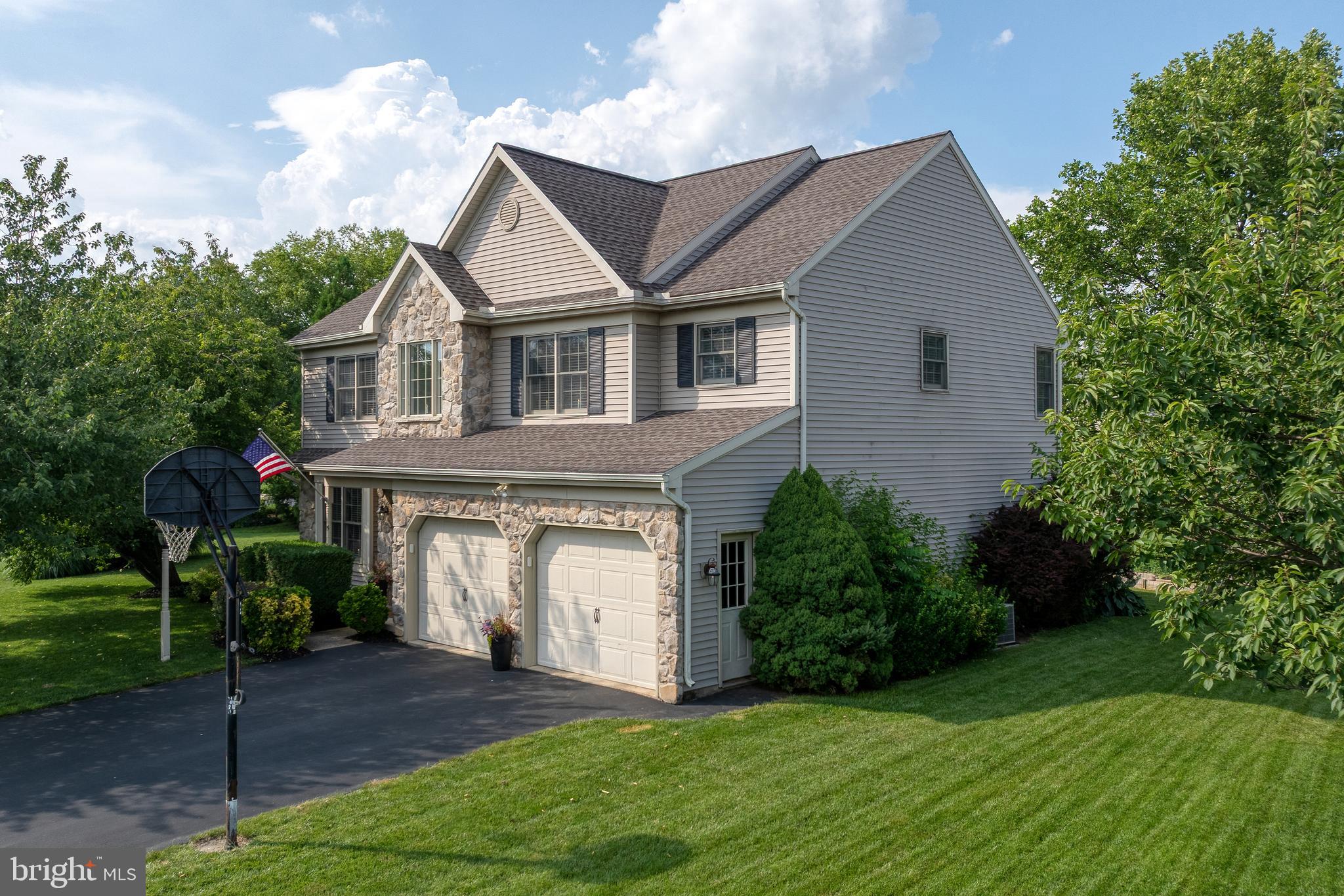 15 Limestone Court Lititz, PA 17543 - Photo 4 of 59 a front view of a house with a yard and garage