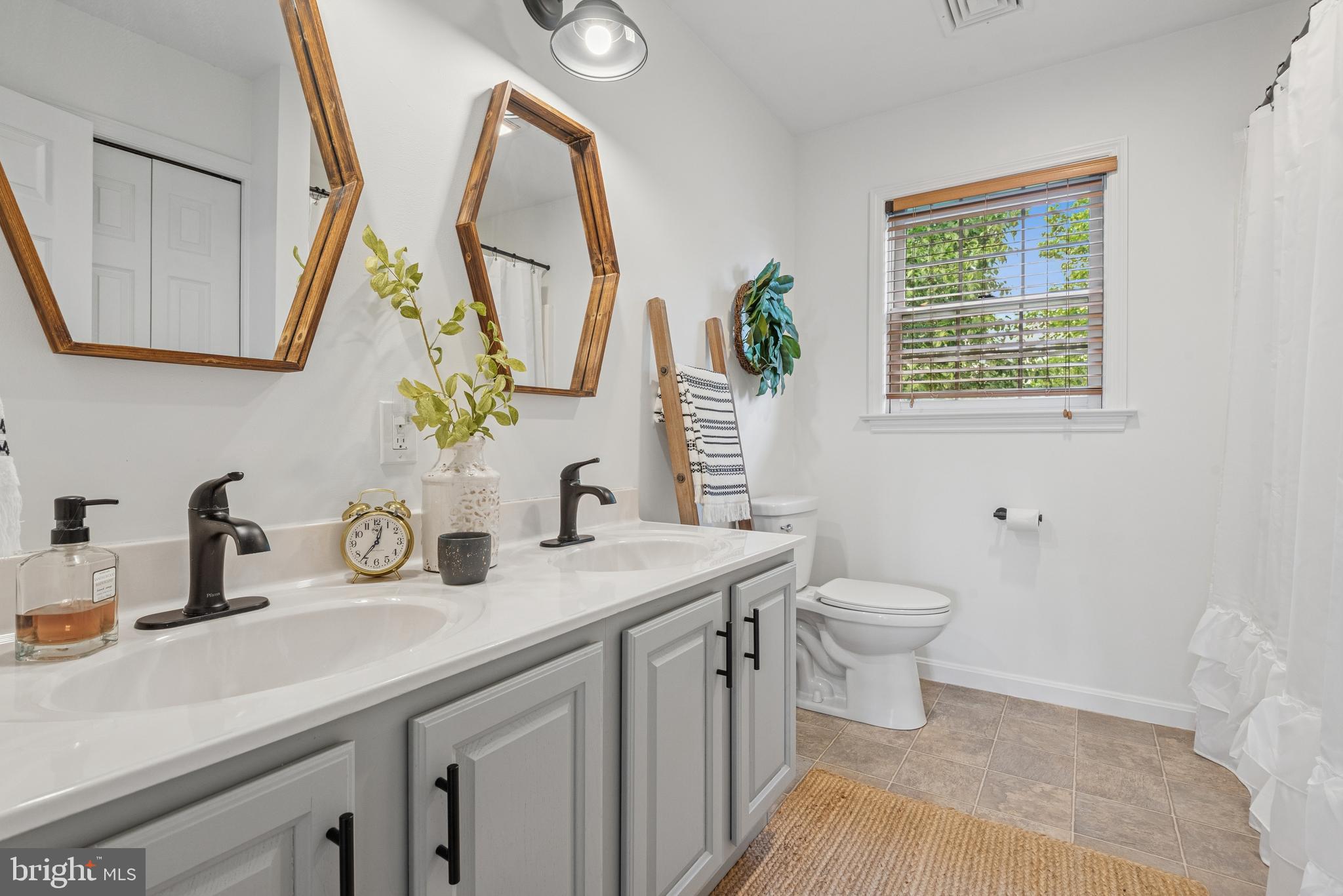 15 Limestone Court Lititz, PA 17543 - Photo 46 of 59 a bathroom with a granite countertop sink mirror vanity and a toilet