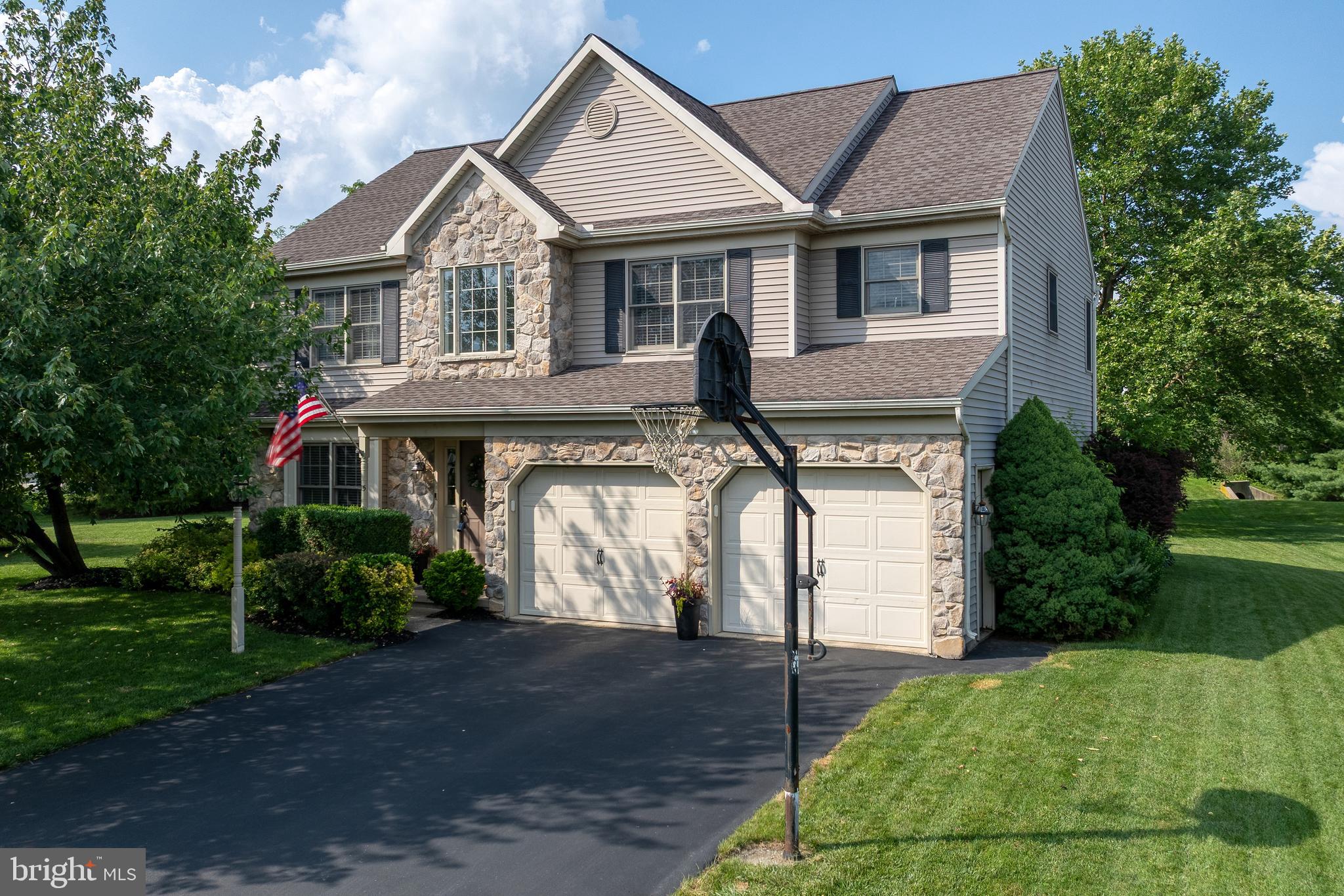15 Limestone Court Lititz, PA 17543 - Photo 5 of 59 a front view of a house with a garden