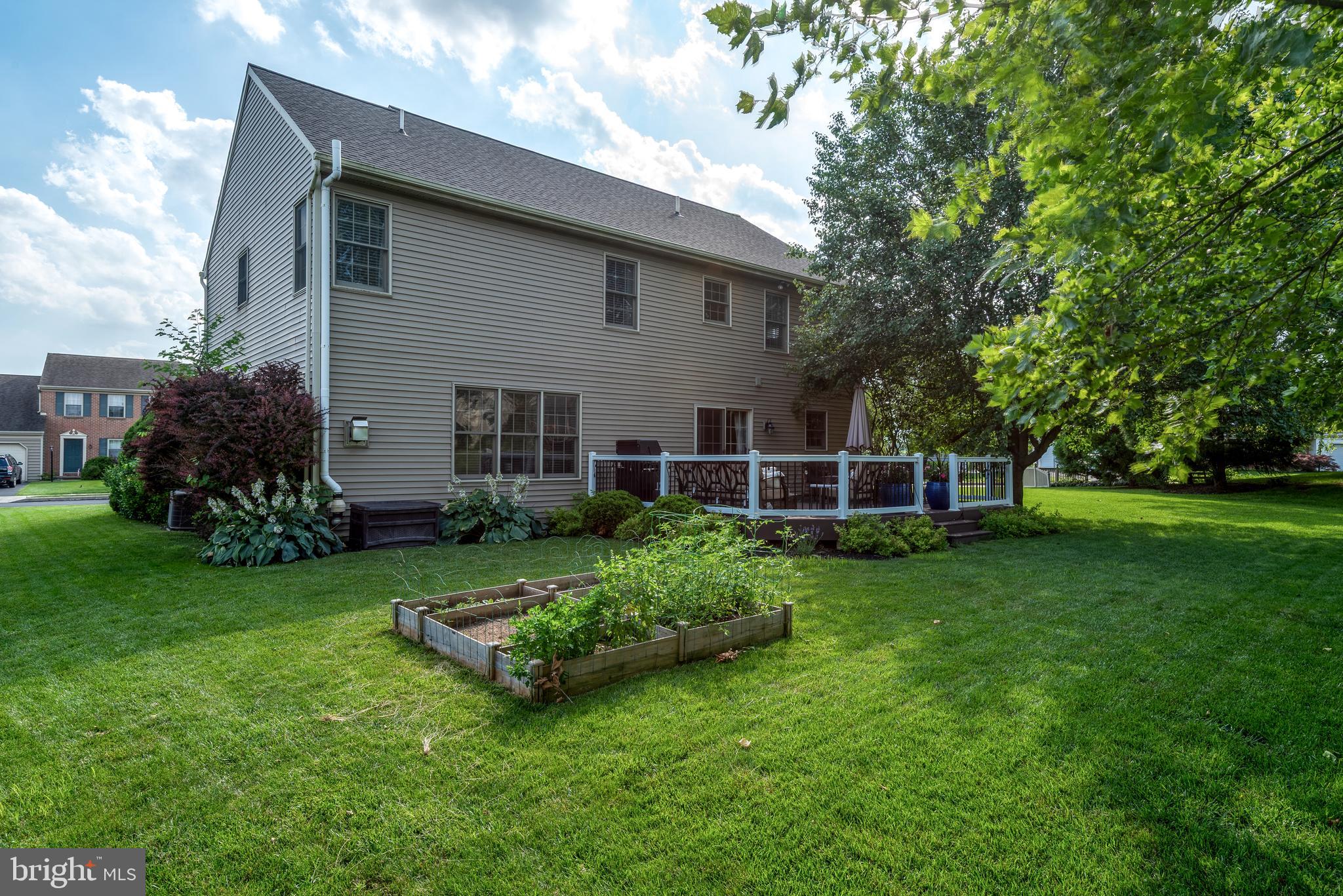 15 Limestone Court Lititz, PA 17543 - Photo 52 of 59 a view of a backyard with plants and a garden