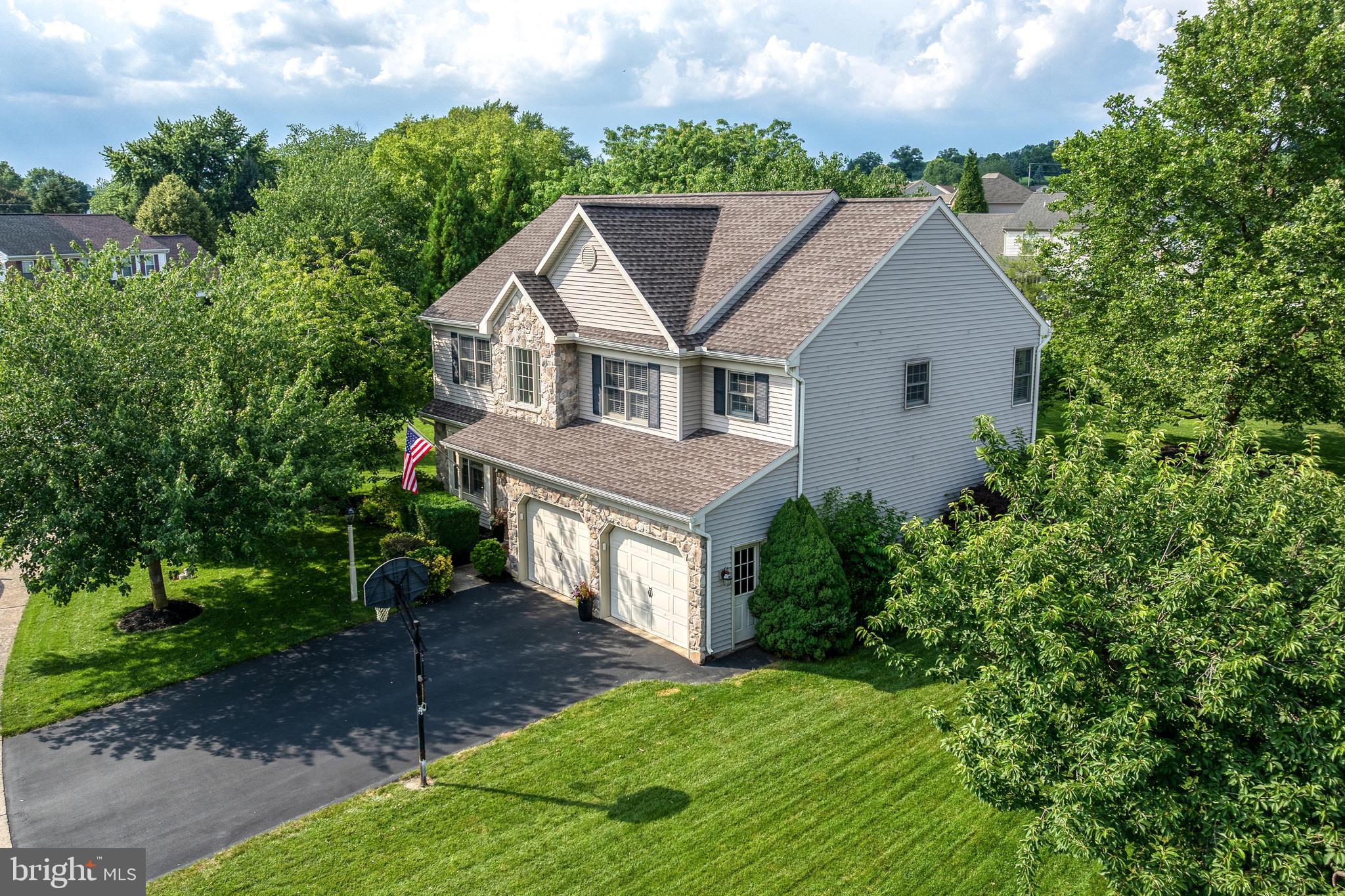 15 Limestone Court Lititz, PA 17543 - Photo 57 of 59 a aerial view of a house with a yard and large trees