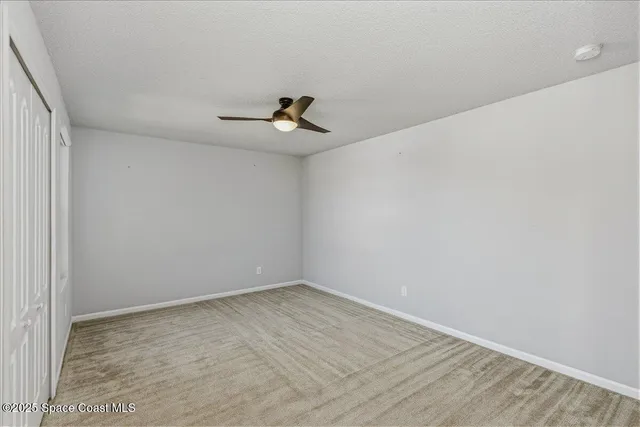 an aerial view of residential houses with outdoor space and lake view