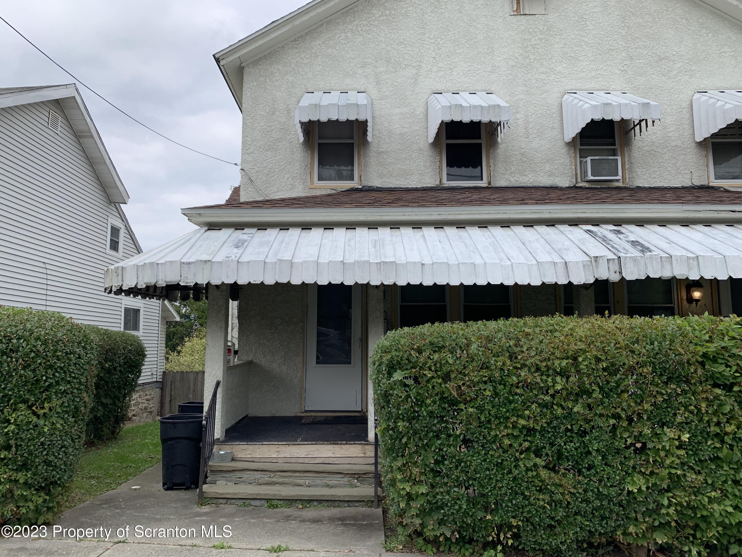 a front view of a house with garage