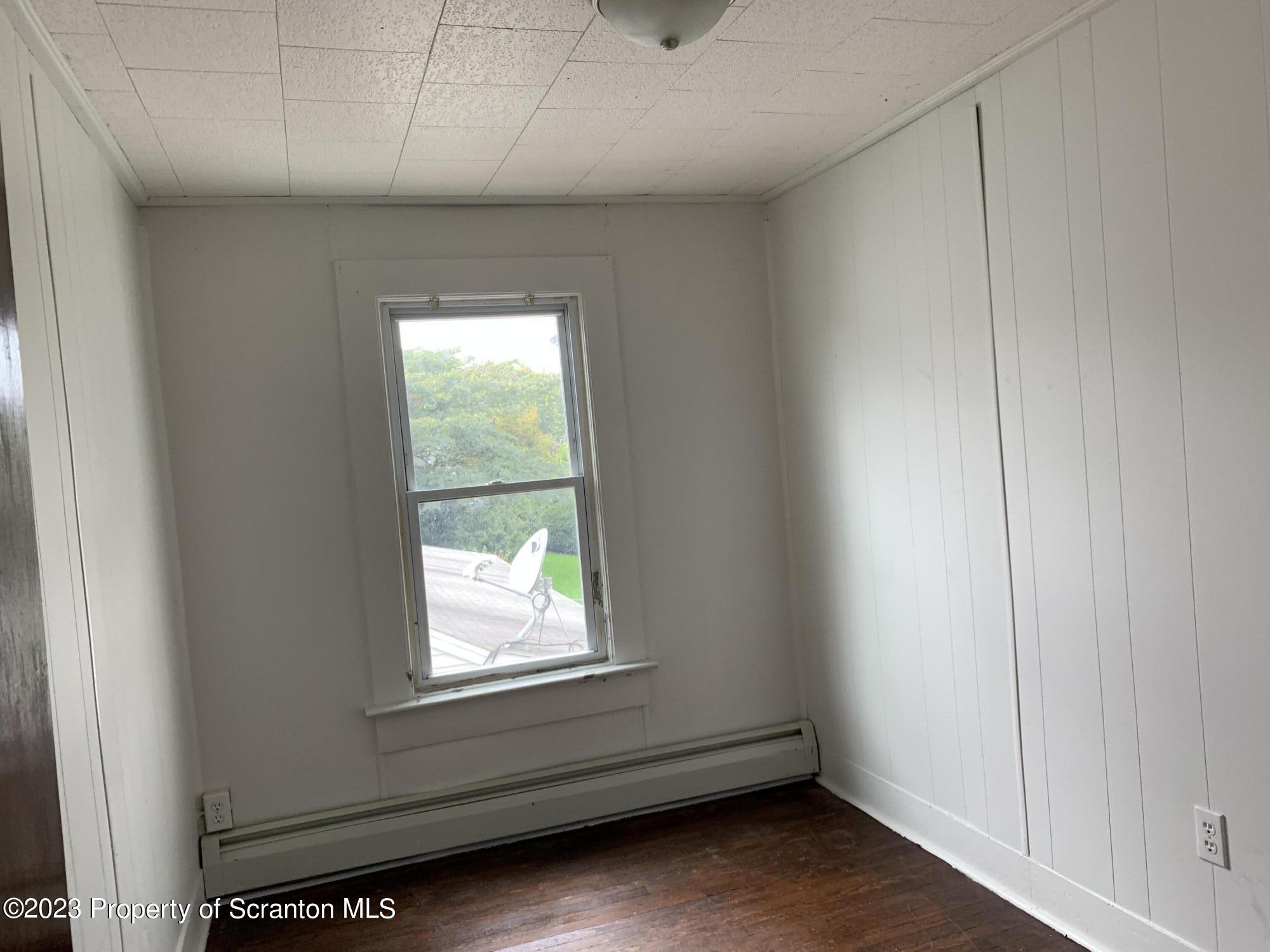 1210 1212 Hampton Street Scranton, PA 18504 - Photo 13 of 17 an empty room with a window
