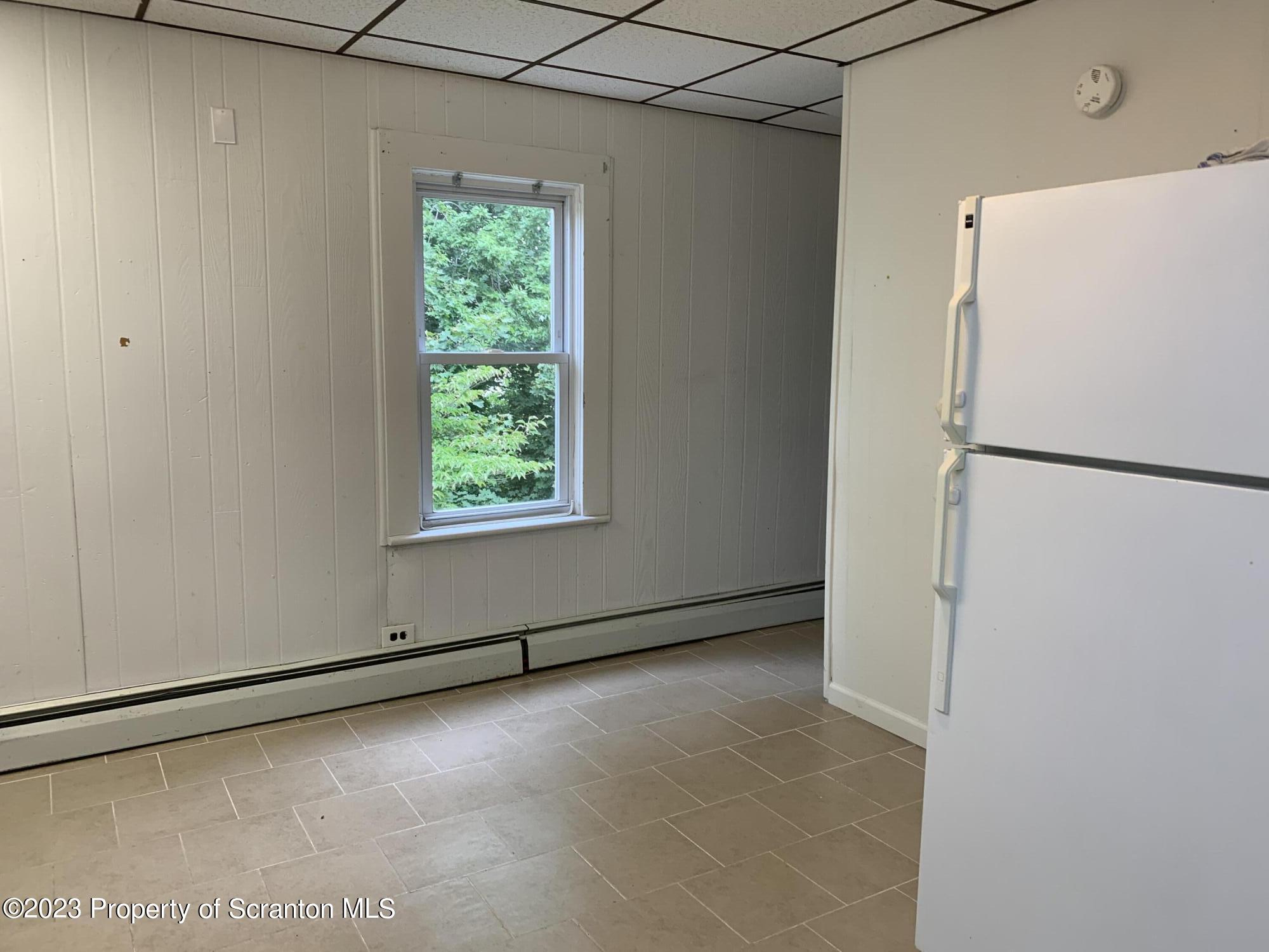 1210 1212 Hampton Street Scranton, PA 18504 - Photo 3 of 17 a view of a refrigerator in a kitchen