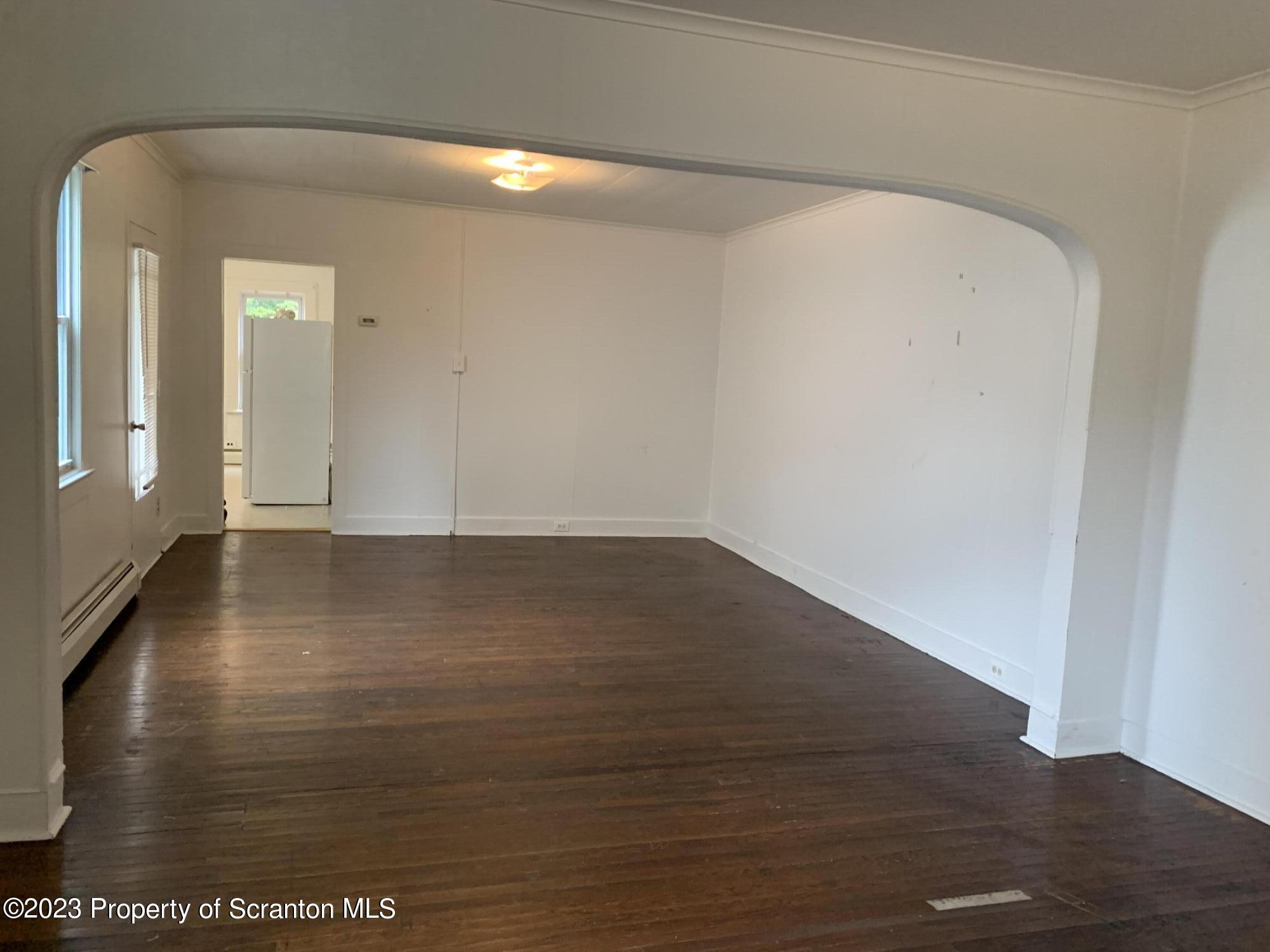 1210 1212 Hampton Street Scranton, PA 18504 - Photo 6 of 17 a view of a room with wooden floor
