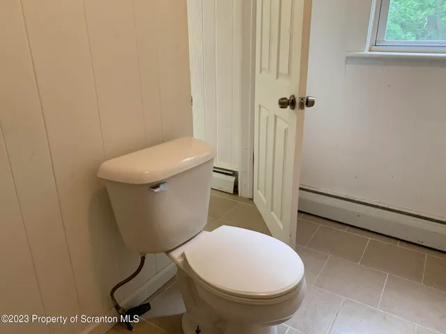 a bathroom with a toilet and a sink