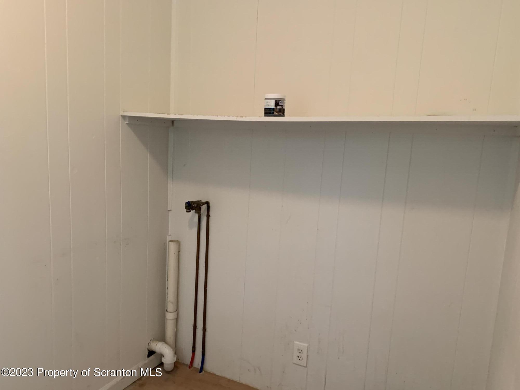 1210 1212 Hampton Street Scranton, PA 18504 - Photo 10 of 17 a view of a closet with wooden floor
