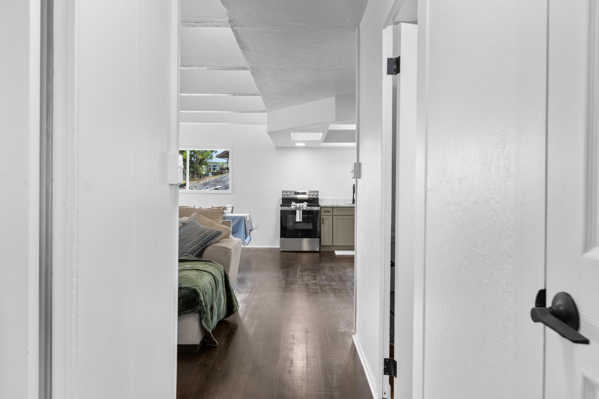 446 Ainaola Drive Hilo, HI 96720 - Photo 13 of 30 a living room with furniture and a hallway