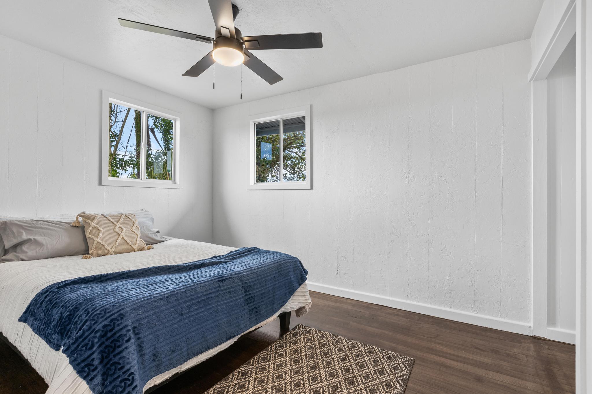 446 Ainaola Drive Hilo, HI 96720 - Photo 14 of 30 a bedroom with a large bed and a window
