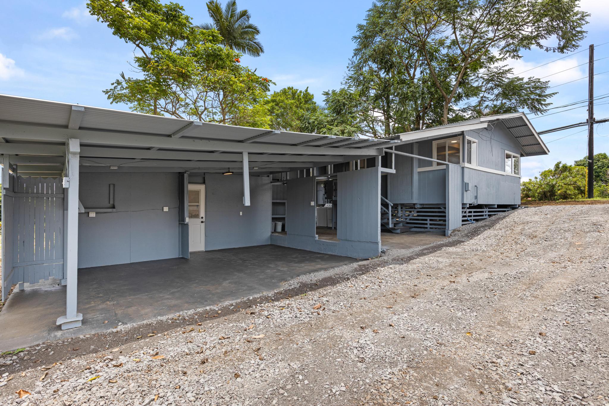 446 Ainaola Drive Hilo, HI 96720 - Photo 20 of 30 a front view of a house with a yard and garage