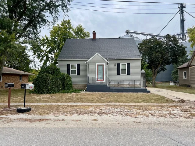 a view of a house with a snow in the yard